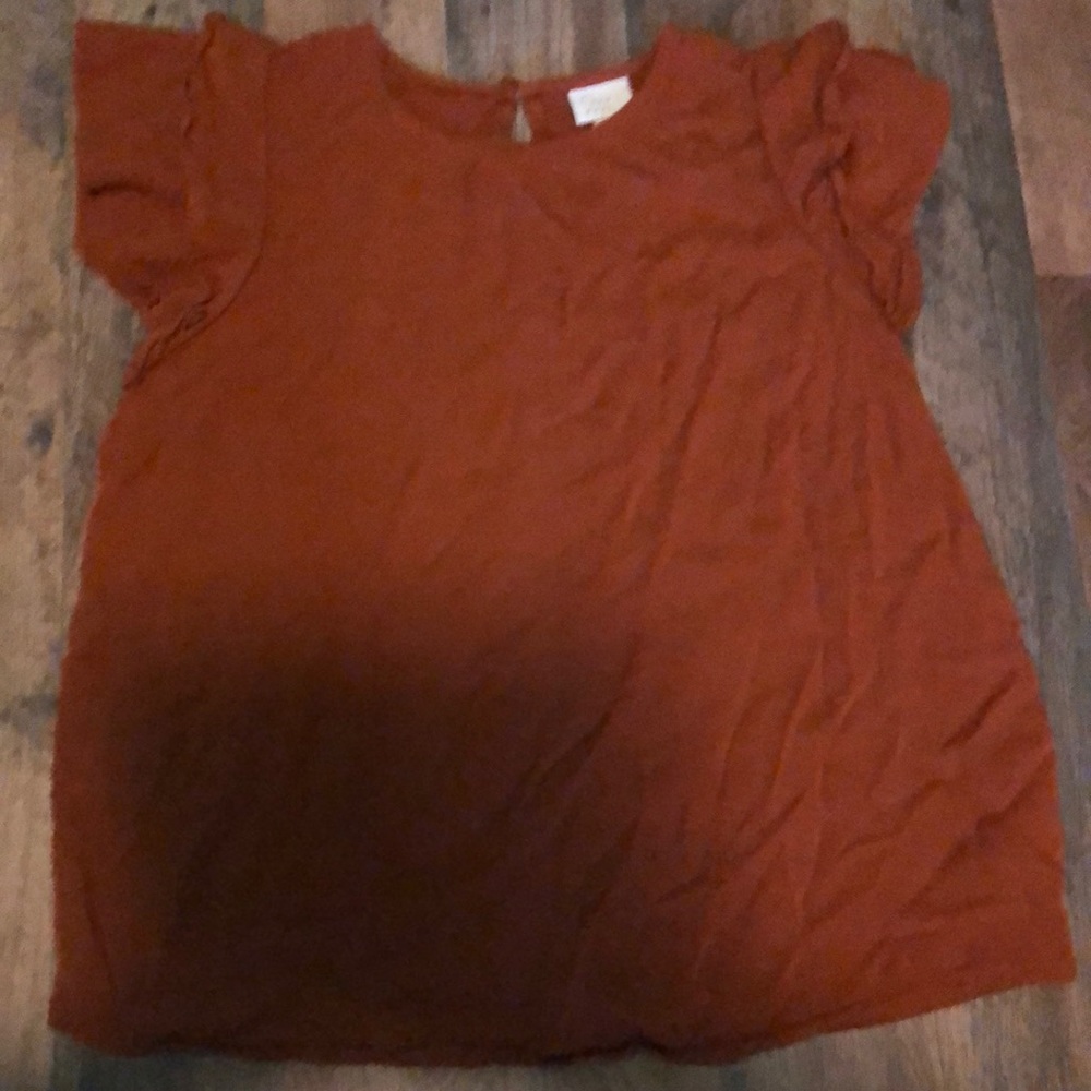This is an orange t shirt for women size small